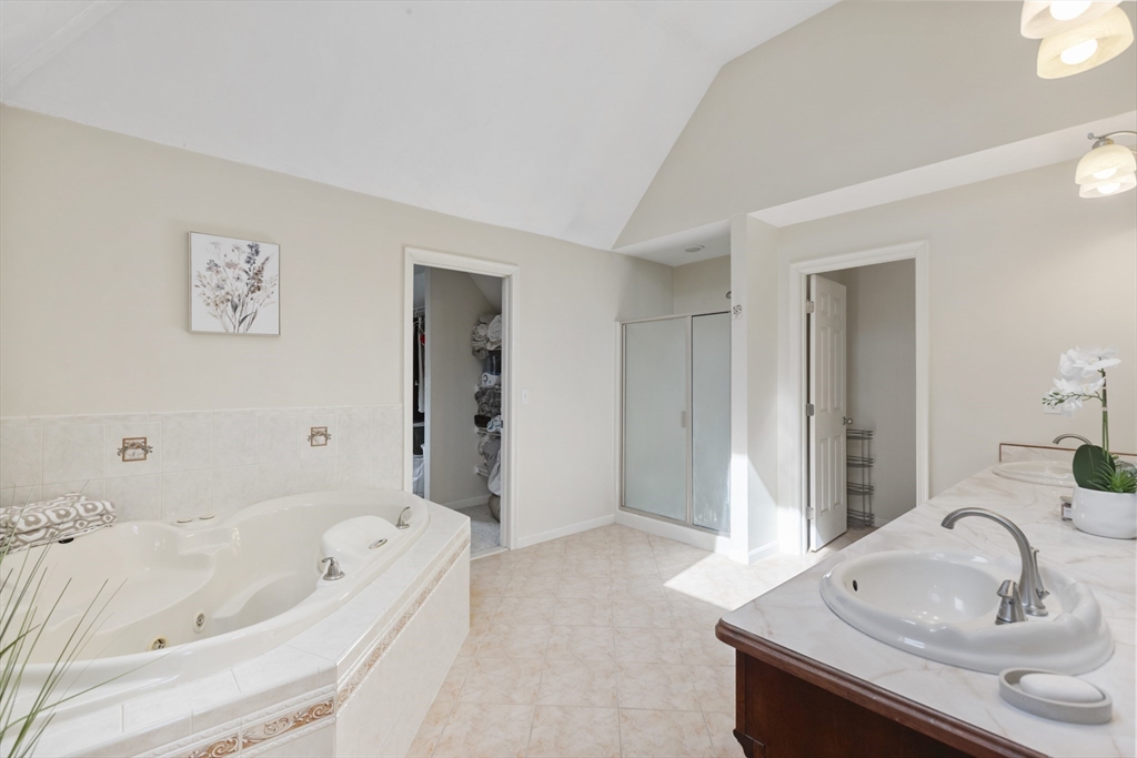 10 Anna Way Norton, MA 02766 - Photo 24 of 40 a bathroom with a tub sink and mirror