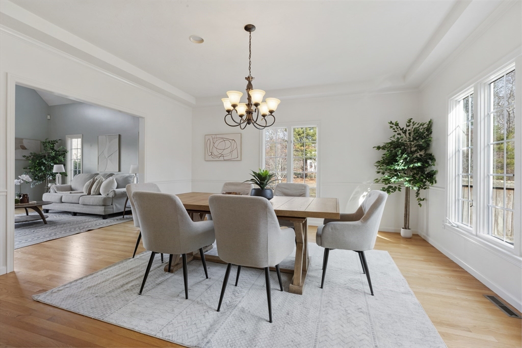 10 Anna Way Norton, MA 02766 - Photo 9 of 40 a view of a dining room with furniture window and wooden floor