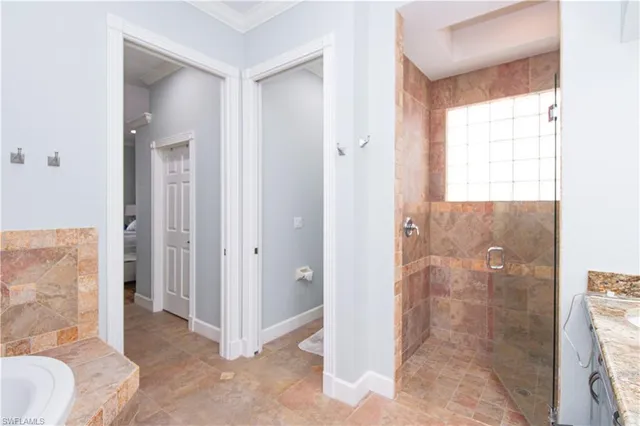 a view of a bathroom with a glass door shower