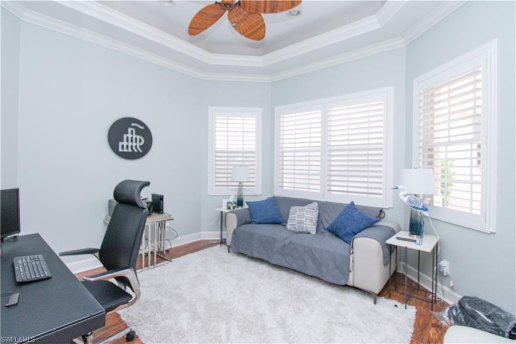 372 Mallory Court Naples, FL 34110 - Photo 20 of 48 a living room with furniture and a window