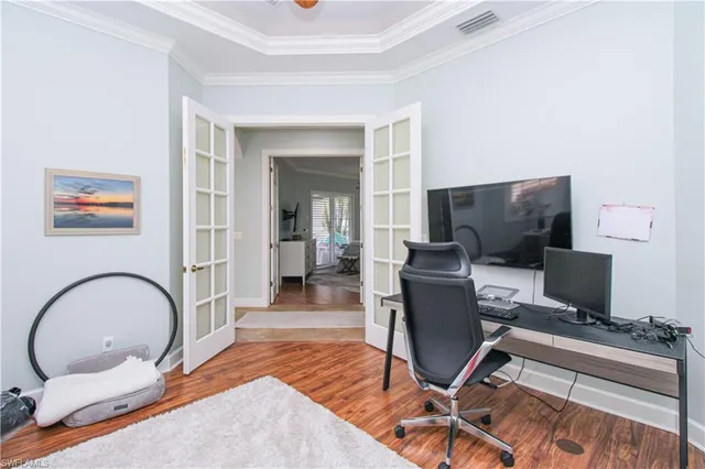 a workspace with furniture and wooden floor