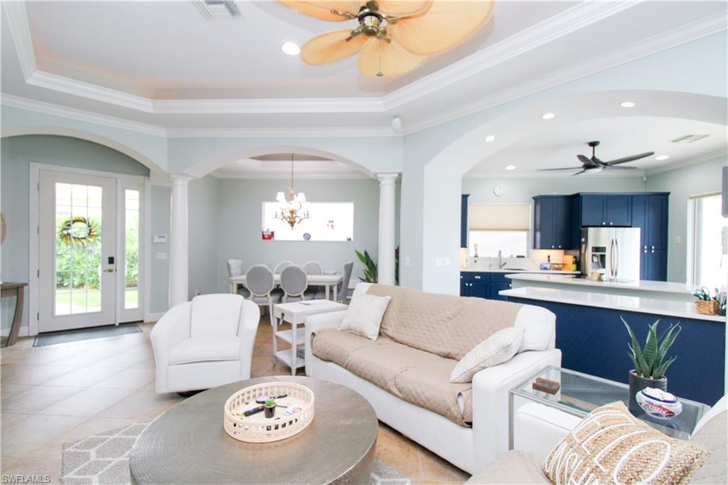 372 Mallory Court Naples, FL 34110 - Photo 3 of 48 a living room with furniture and a large window