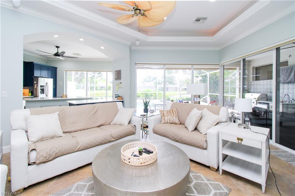 372 Mallory Court Naples, FL 34110 - Photo 4 of 48 a living room with furniture and a large window