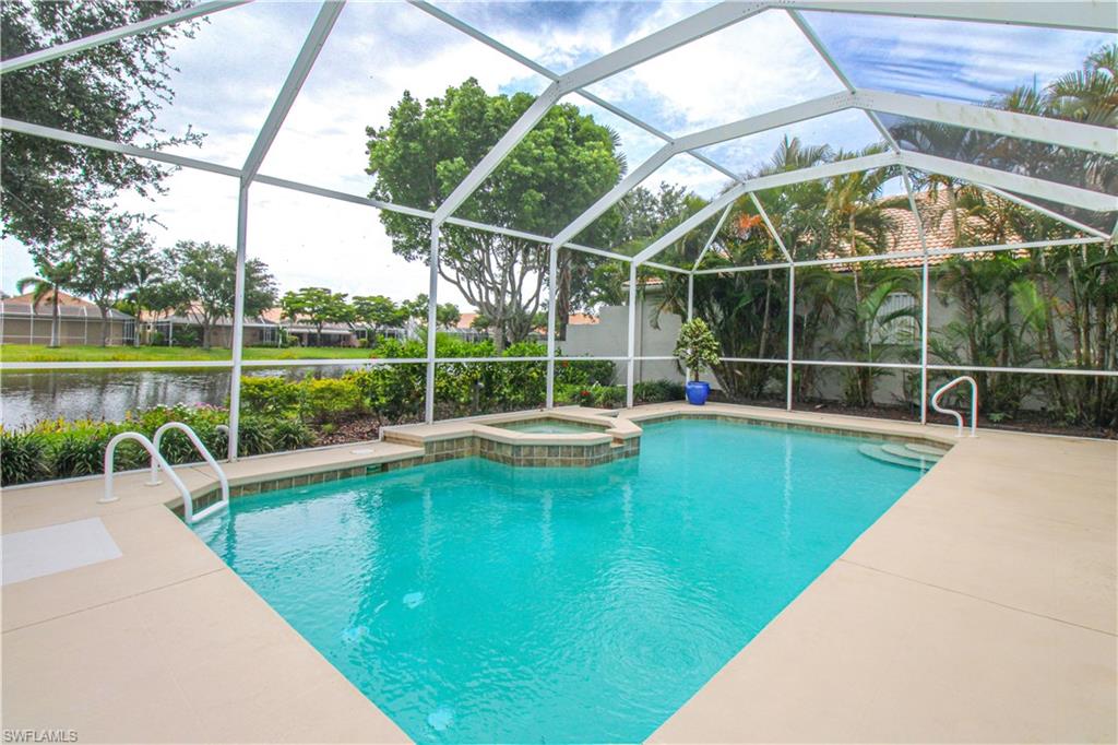 372 Mallory Court Naples, FL 34110 - Photo 45 of 48 a view of a swimming pool with a lake view