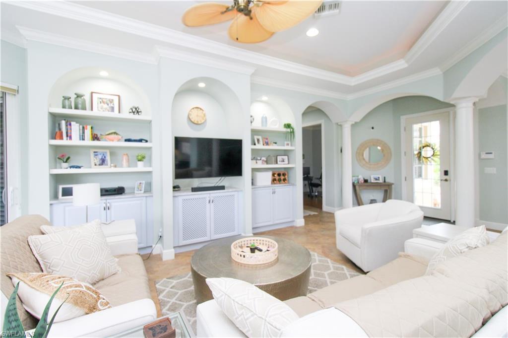 372 Mallory Court Naples, FL 34110 - Photo 5 of 48 a living room with furniture and a flat screen tv