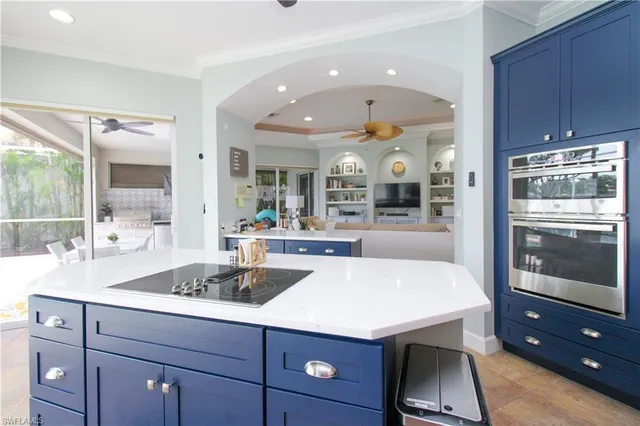 a kitchen with a sink and wooden cabinets