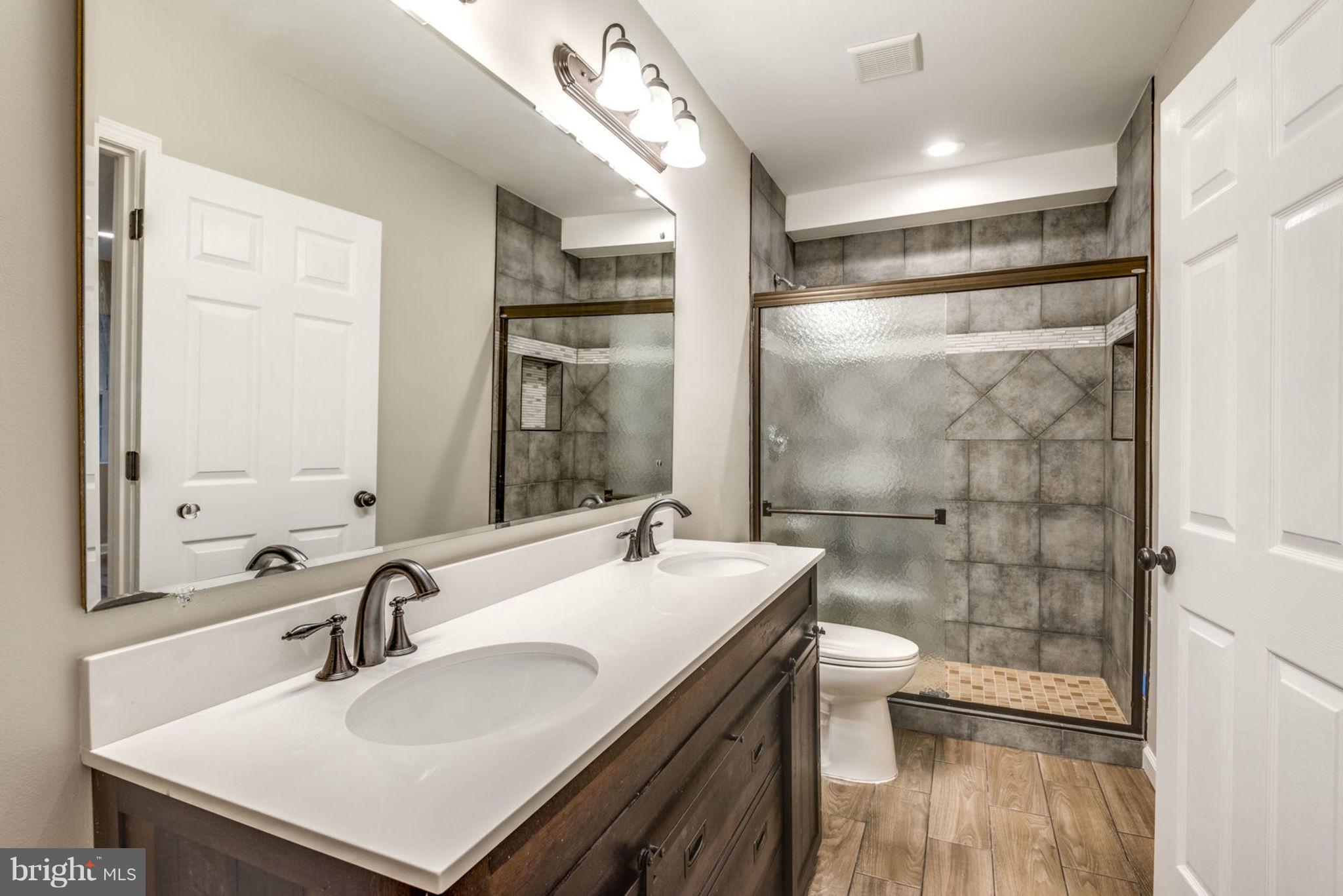 11405 Drop Forge Lane Reston, VA 20191 - Photo 26 of 30 Basement Bath with dual vanities!