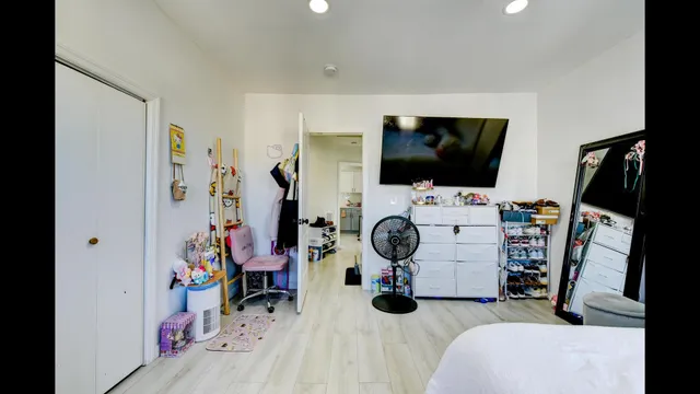 a bathroom with a sink mirror and shower