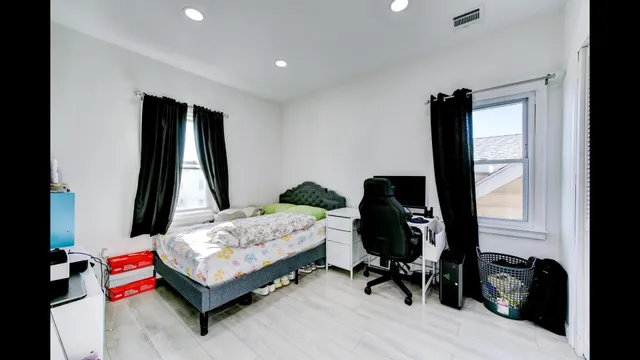 a view of a workspace with furniture and wooden floor