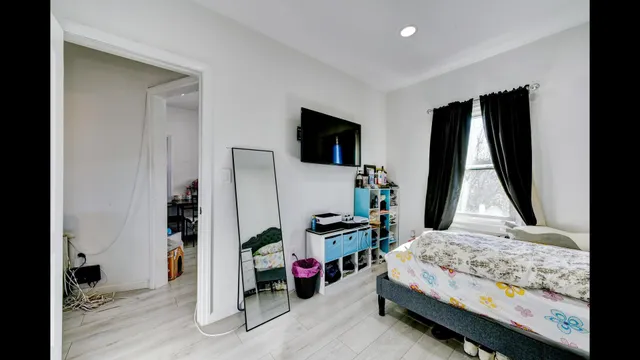 a view of a hallway with dining area and chandelier