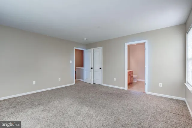 a view of a workspace with furniture and a potted plant