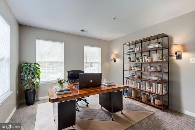 a kitchen with stainless steel appliances granite countertop a stove microwave and sink