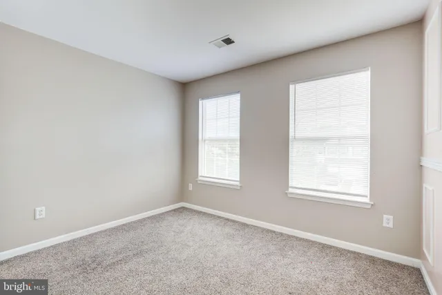 a view of house with backyard and a slide