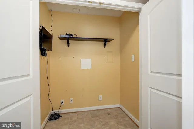 a view of a room that has a window and chair