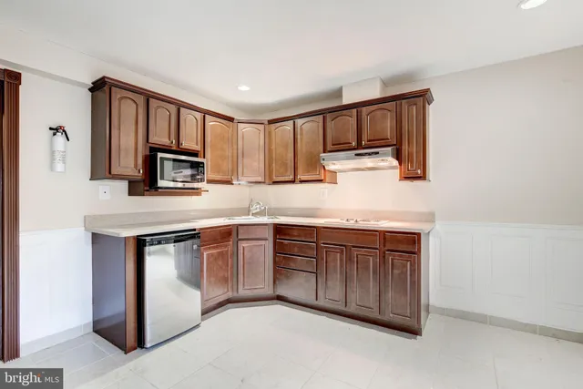 a view of a house with brick walls and potted plants