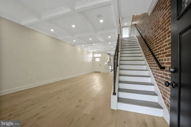 a view of a room with wooden floor