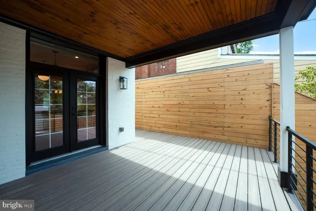 a view of a deck with wooden floor and outdoor space