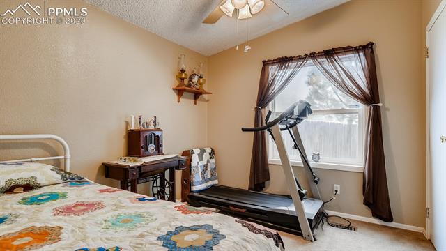 17570 Sage Crest Road Peyton, CO 80831 - Photo 19 of 25 Another spacious bedroom.