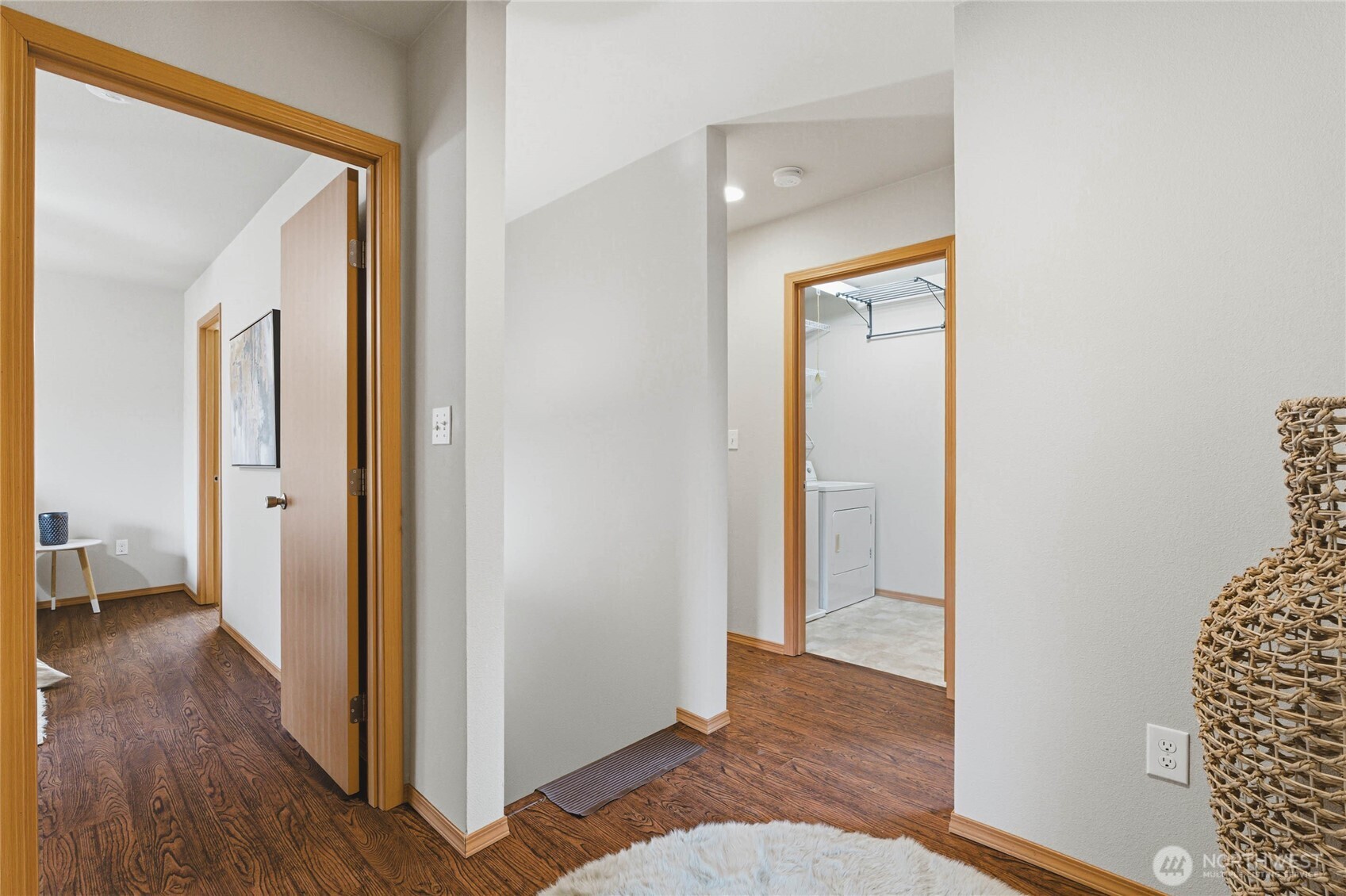 3765 Earendel Avenue Bremerton, WA 98310 - Photo 15 of 29 a view of a hallway with wooden floor and a livingroom