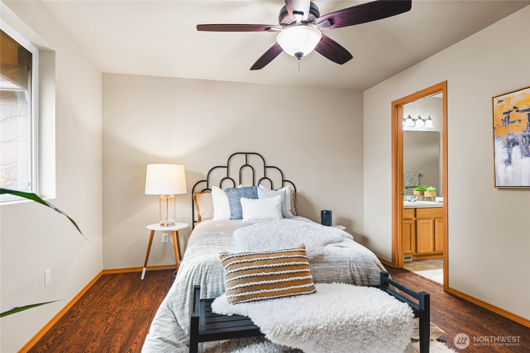 3765 Earendel Avenue Bremerton, WA 98310 - Photo 17 of 29 a bedroom with a bed and a chandelier