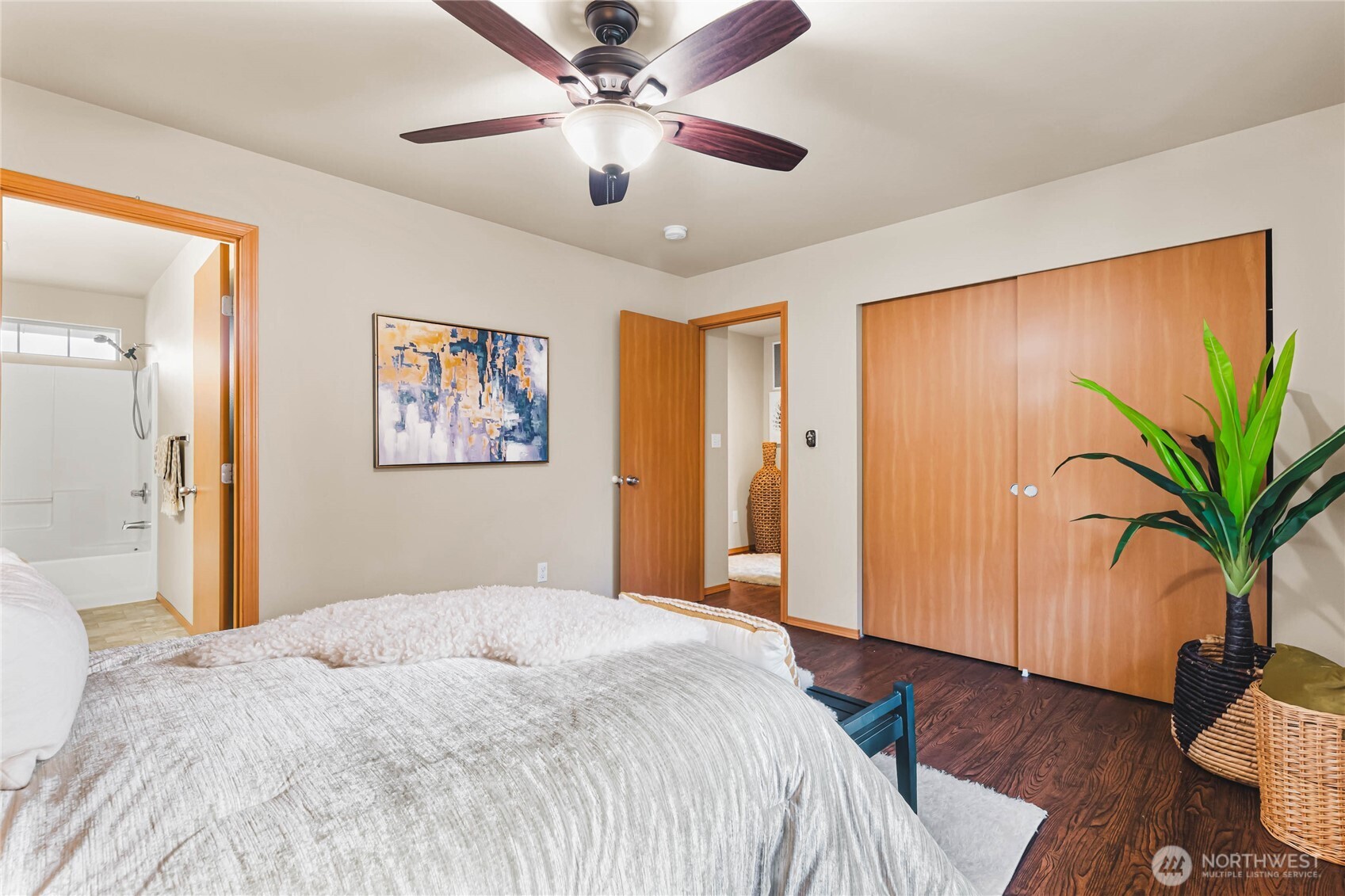 3765 Earendel Avenue Bremerton, WA 98310 - Photo 18 of 29 a bedroom with a large bed chandelier and a window