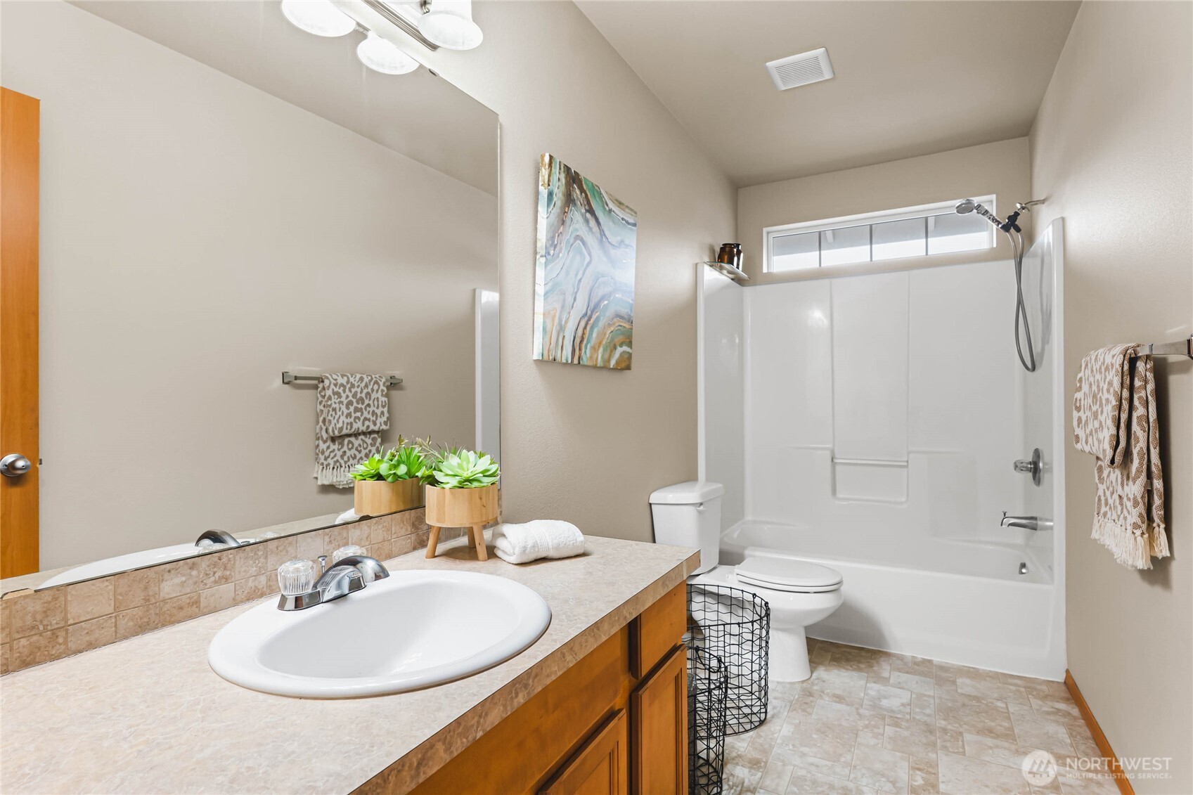 3765 Earendel Avenue Bremerton, WA 98310 - Photo 19 of 29 a bathroom with a granite countertop sink toilet and shower