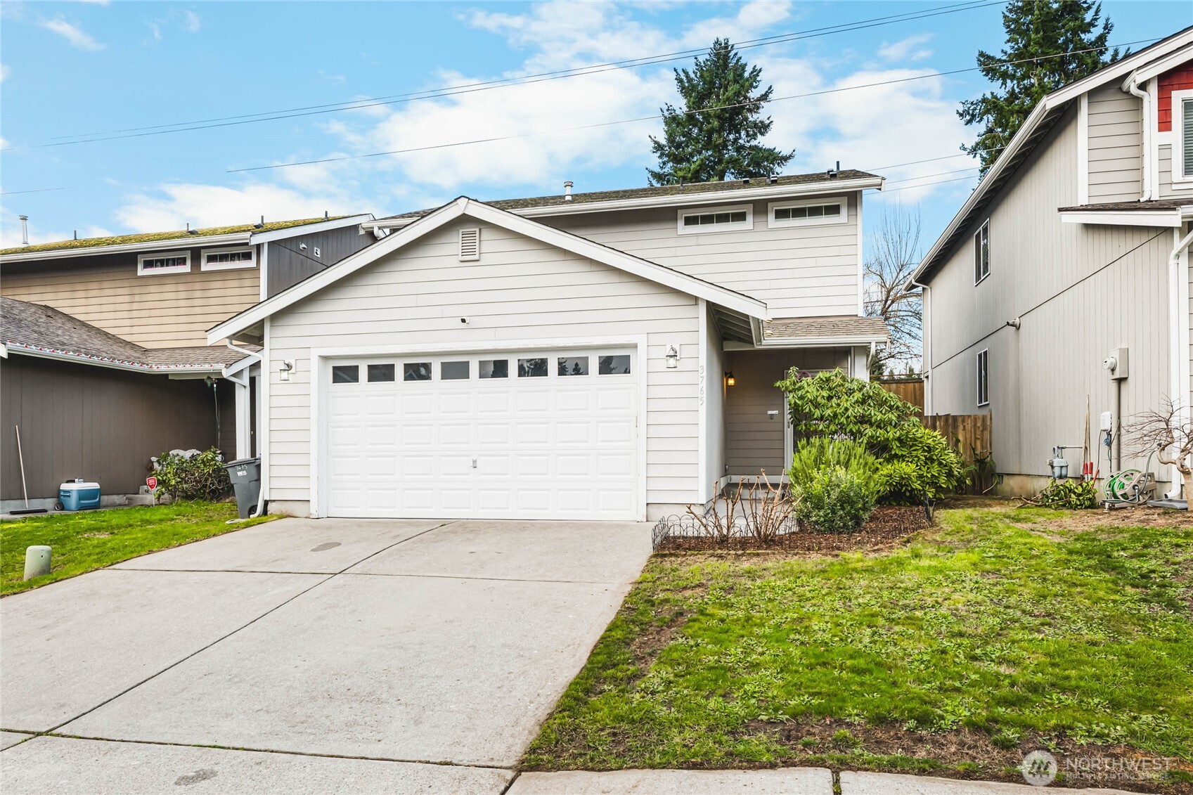 3765 Earendel Avenue Bremerton, WA 98310 - Photo 2 of 29 a view of a house with a yard and plants