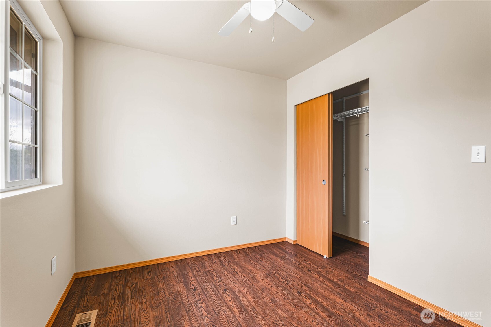 3765 Earendel Avenue Bremerton, WA 98310 - Photo 23 of 29 an empty room with wooden floor and windows
