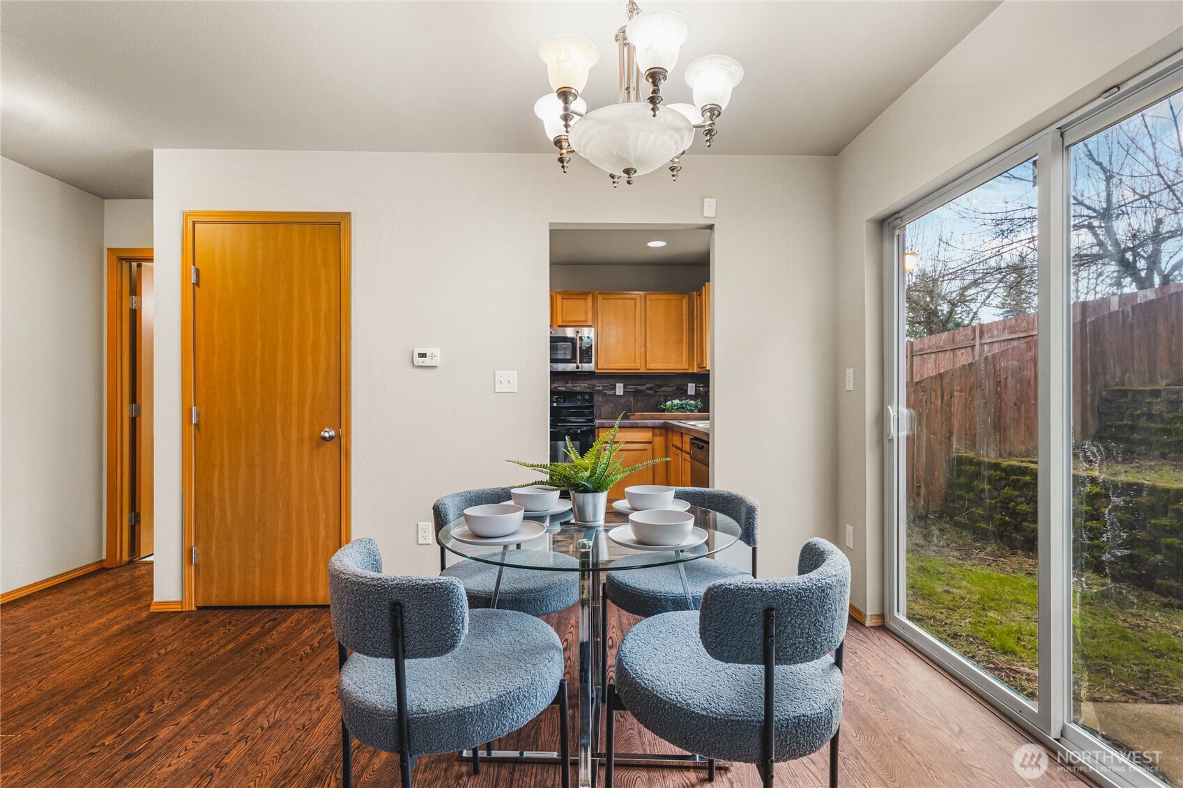 3765 Earendel Avenue Bremerton, WA 98310 - Photo 8 of 29 a dining room with furniture a chandelier and wooden floor