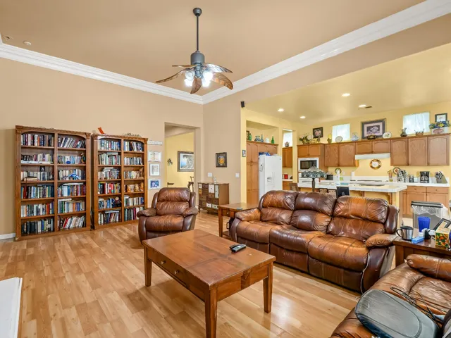 a living room with furniture a rug and a chandelier