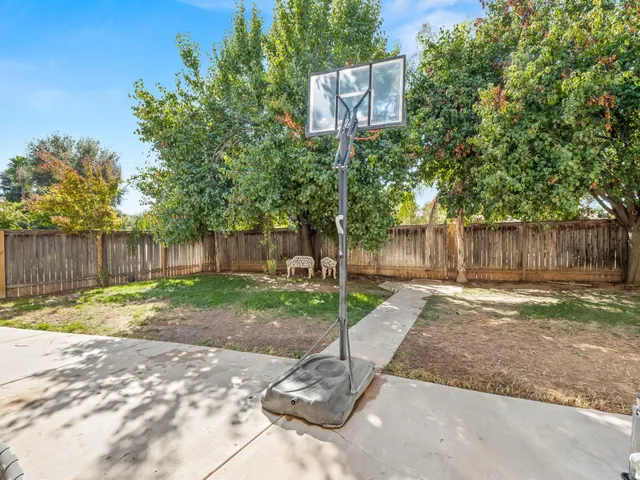 a sign board with wooden fence