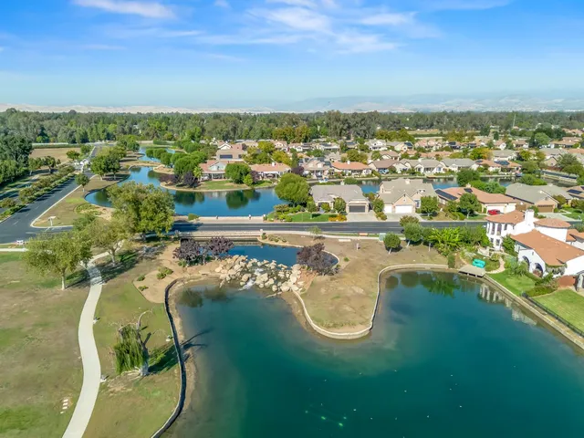 an aerial view of a house with a swimming pool