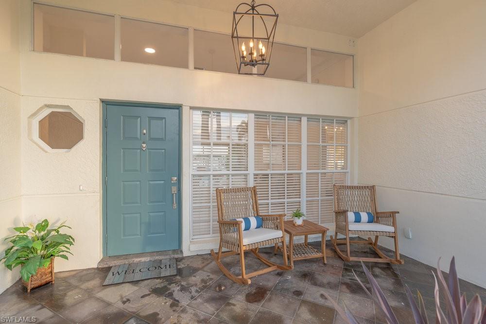 6831 Mill Pond Circle Naples, FL 34109 - Photo 19 of 45 a dining room with furniture and a window
