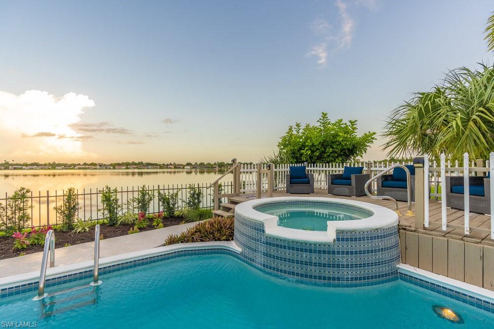 6831 Mill Pond Circle Naples, FL 34109 - Photo 21 of 45 a balcony with table and chairs