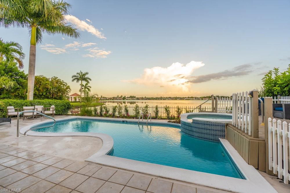 6831 Mill Pond Circle Naples, FL 34109 - Photo 22 of 45 a view of swimming pool with outdoor seating and plants