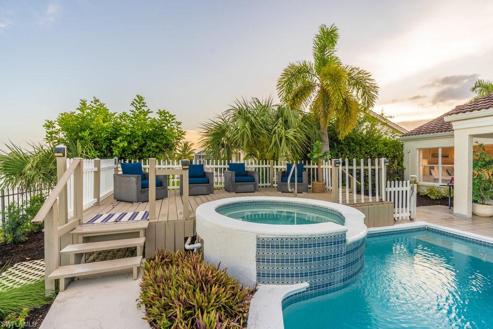 6831 Mill Pond Circle Naples, FL 34109 - Photo 23 of 45 a view of a house with backyard and sitting area