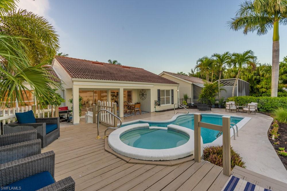 6831 Mill Pond Circle Naples, FL 34109 - Photo 24 of 45 a view of a house with swimming pool and sitting area