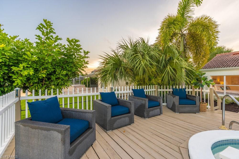6831 Mill Pond Circle Naples, FL 34109 - Photo 25 of 45 a view of a patio with couches and a potted plant on a table