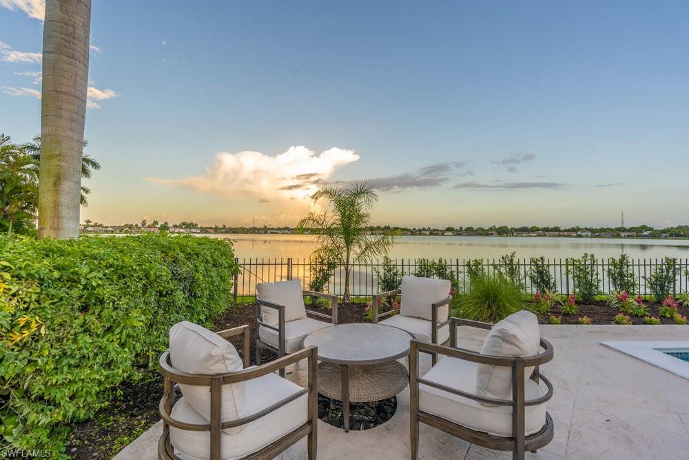 6831 Mill Pond Circle Naples, FL 34109 - Photo 28 of 45 a view of a chair and table on the terrace