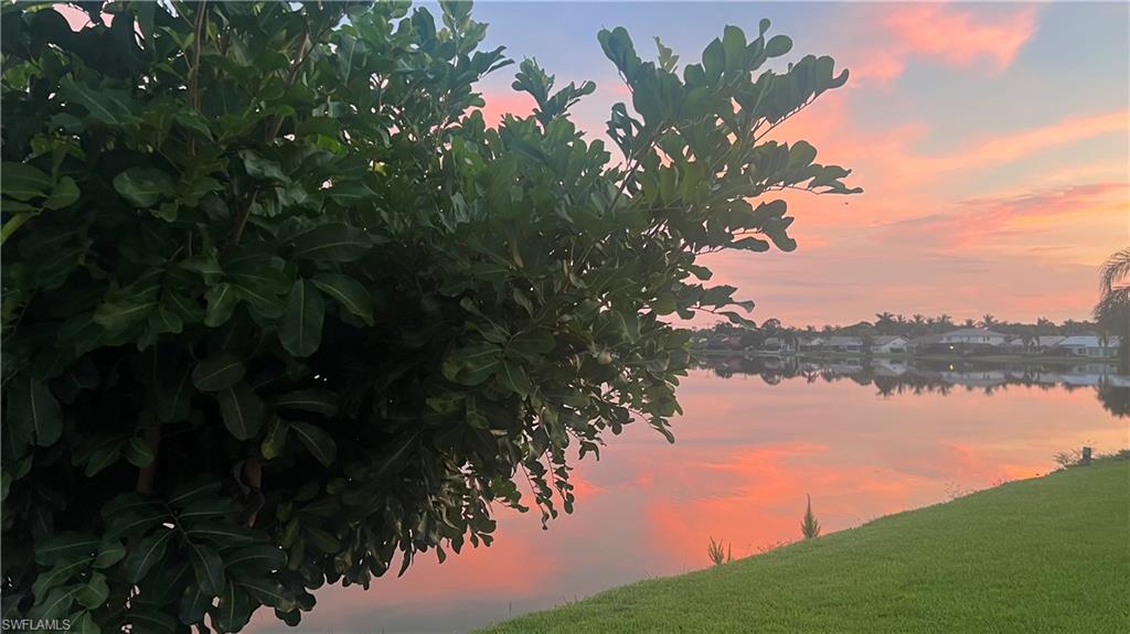 6831 Mill Pond Circle Naples, FL 34109 - Photo 33 of 45 a view of a lake with a lake