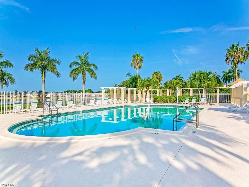 6831 Mill Pond Circle Naples, FL 34109 - Photo 37 of 45 a view of swimming pool and outdoor kitchen