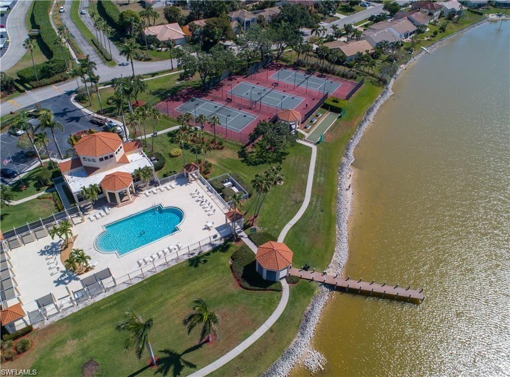 6831 Mill Pond Circle Naples, FL 34109 - Photo 39 of 45 an aerial view of a house with a swimming pool