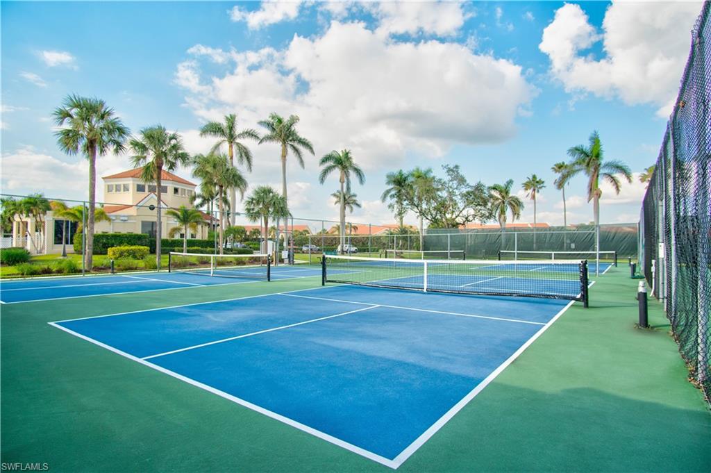 6831 Mill Pond Circle Naples, FL 34109 - Photo 42 of 45 a view of an outdoor space and tennis court
