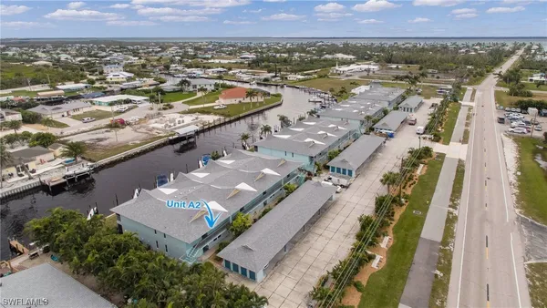 an aerial view of residential houses with outdoor space
