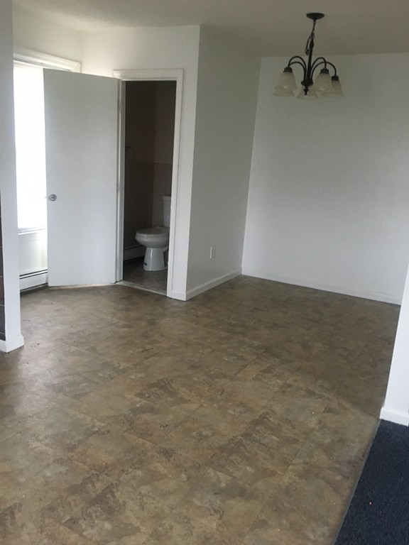 128 Stewart Street Fall River, MA 02720 - Photo 11 of 14 wooden floor in a room