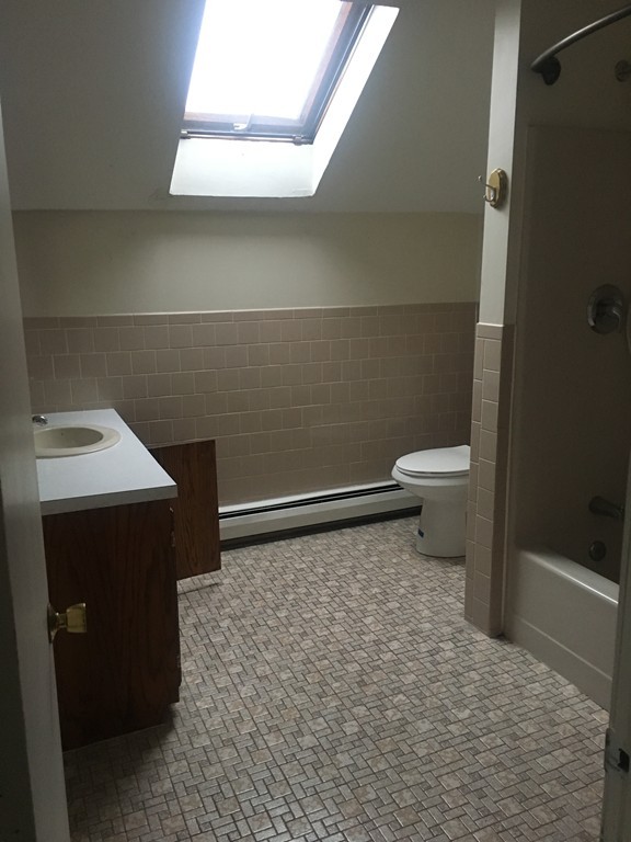 128 Stewart Street Fall River, MA 02720 - Photo 13 of 14 a bathroom with a sink a toilet and a shower