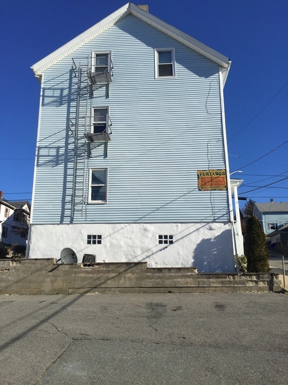 128 Stewart Street Fall River, MA 02720 - Photo 3 of 14 a view of building along with street