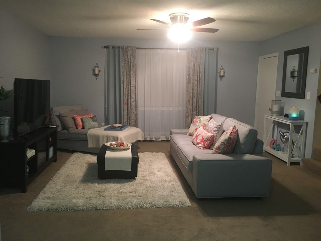 128 Stewart Street Fall River, MA 02720 - Photo 5 of 14 a living room with furniture and a flat screen tv
