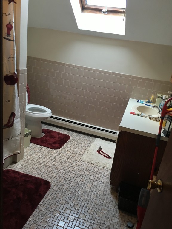 128 Stewart Street Fall River, MA 02720 - Photo 9 of 14 a bathroom with a sink and a toilet