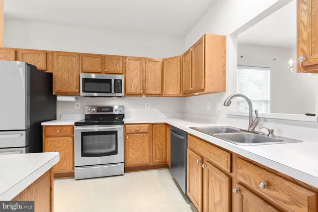 a bathroom with a sink a vanity and a mirror